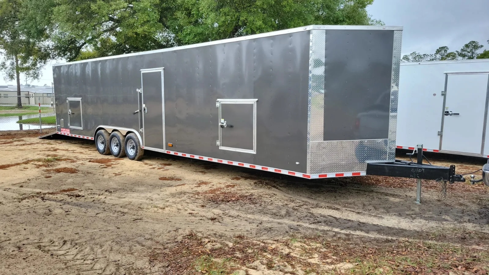 Second premium 36 foot enclosed trailer unit with composite exterior and ramp door