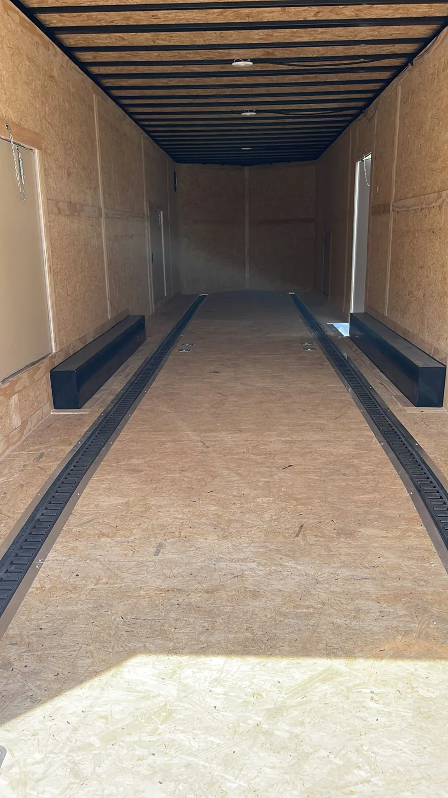 Interior of an enclosed trailer with E-track and D-rings