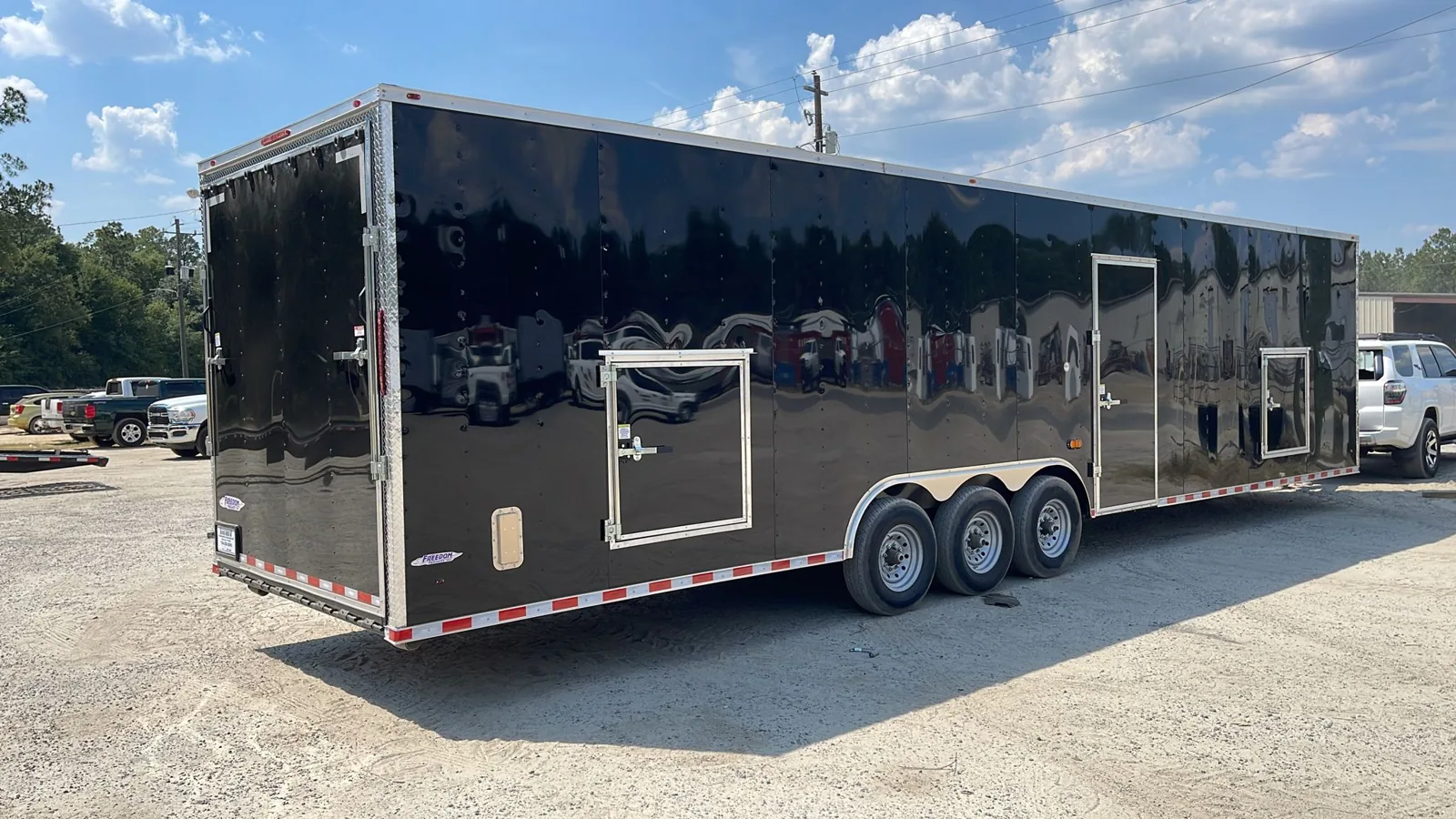 Enclosed trailer with rear ramp door open