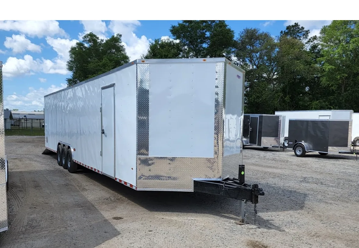 Enclosed car hauler hitched and ready for delivery